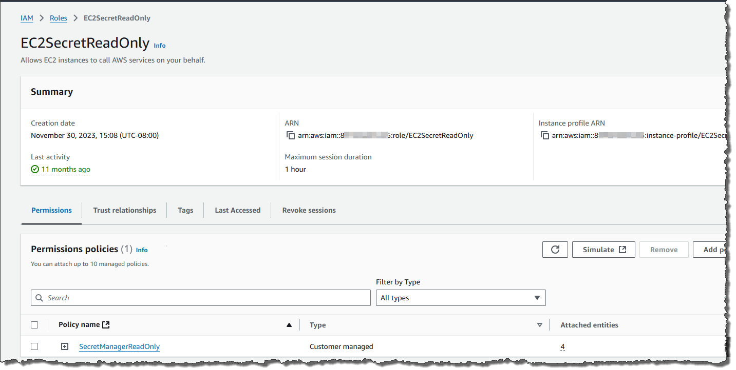 The image shows an IAM role named "EC2SecretReadOnly" Under "Permissions policies," the policy "SecretManagerReadOnly" is selected.