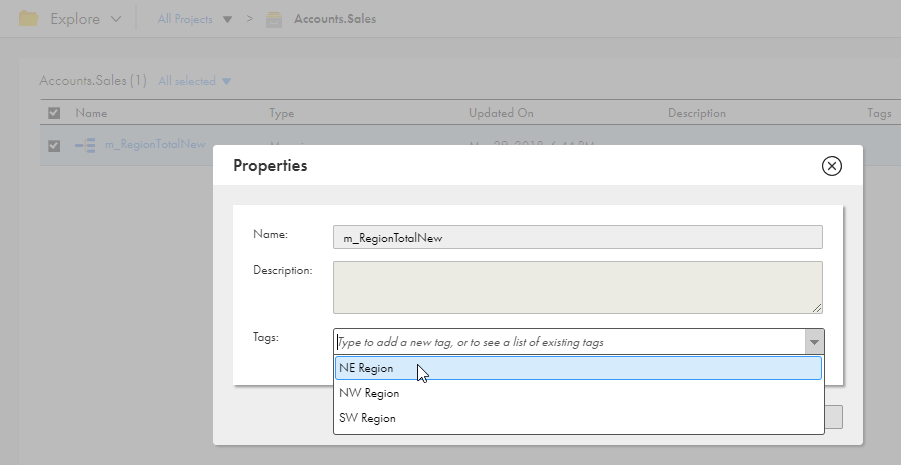 The Properties dialog box shows the asset name as m_RegionTotalNew. It includes the description and the Tags drop-down list shows tags associated with the asset.