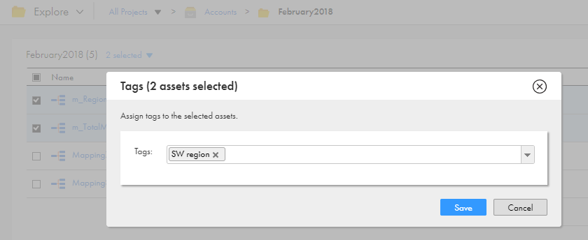 The Tags dialog box shows two assets selected and includes the Tags drop-down list. The bottom of the box contains the Save and Cancel buttons.
